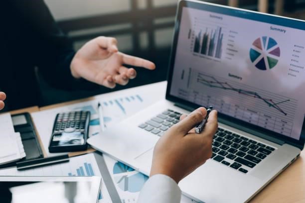 Colleagues are stress talking about the results report and compared with the financial information on the laptop screen. Colleagues are stress talking about the results report and compared with the financial information on the laptop screen. Essential Accounting Tips stock pictures, royalty-free photos & images